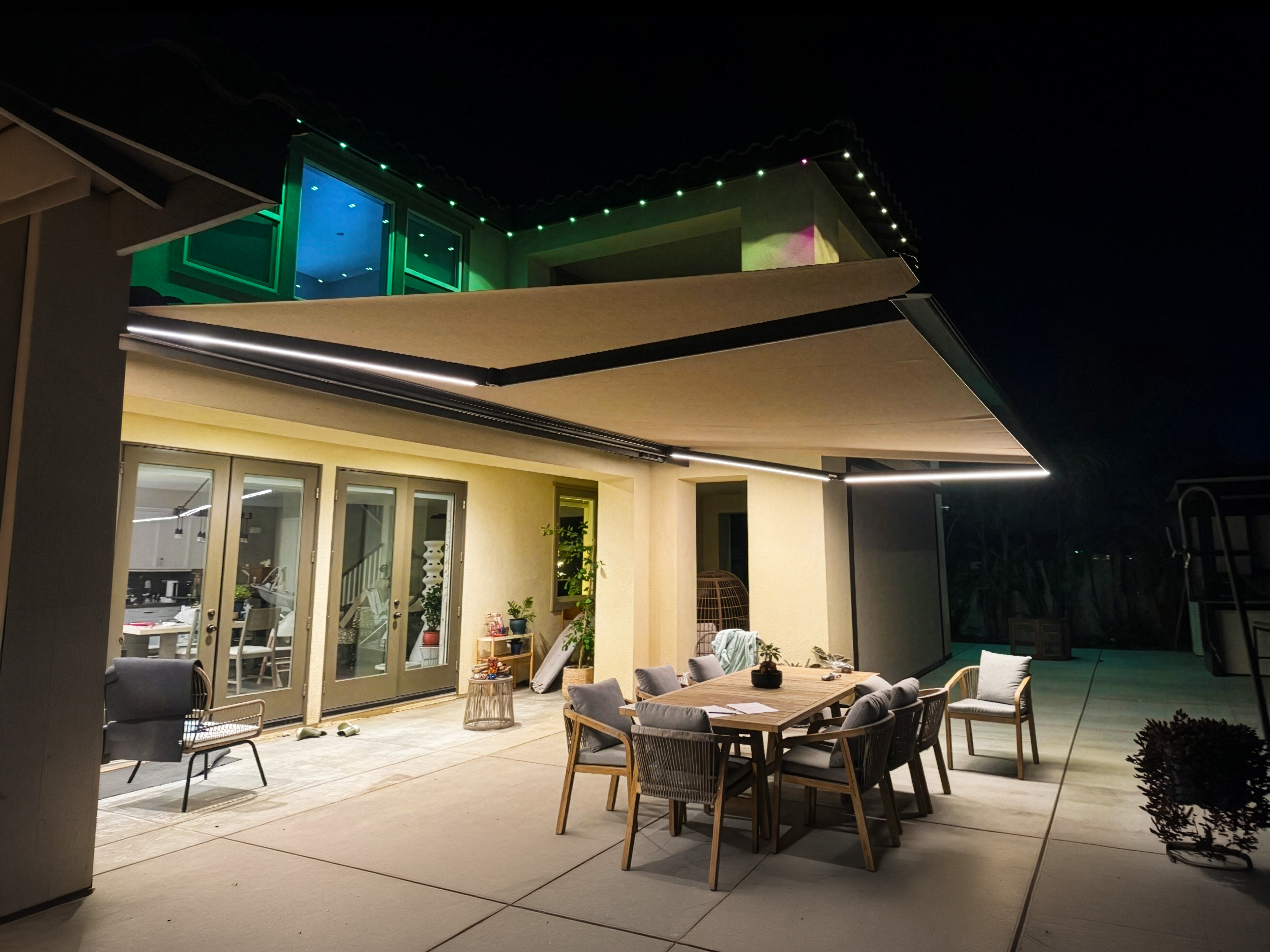 Retractable awning over patio at night